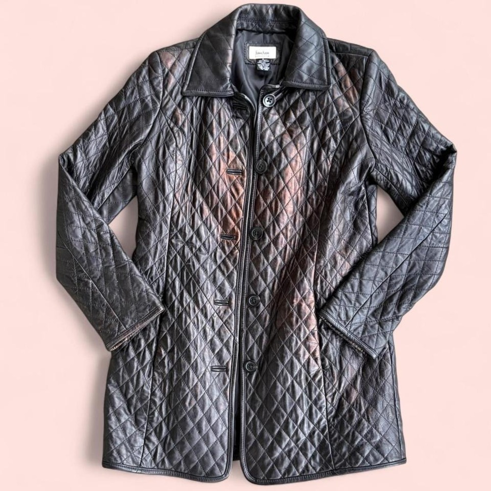 Neiman Marcus black leather jacket with quilted detail.